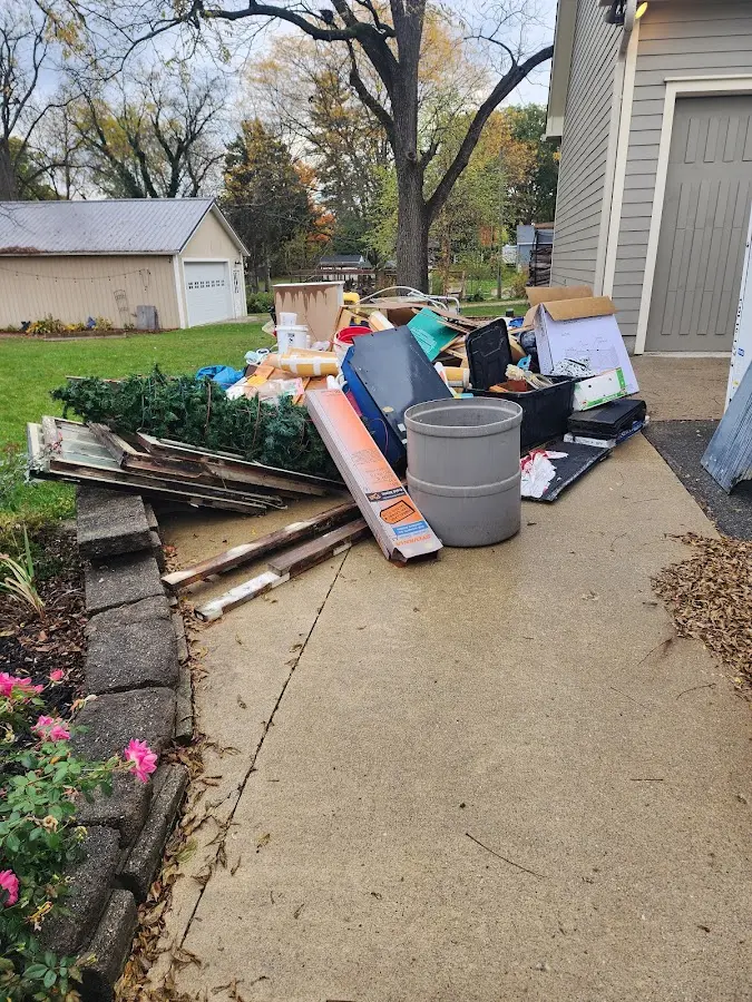 Dumpster being loaded with debris for 3 Yard Dumpster Rental in Canton